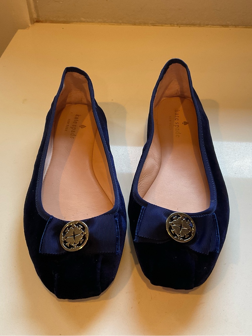 kate spade navy velvet bow ballet flats with gold logo
